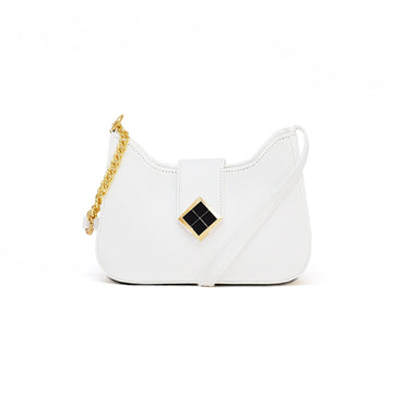 White handbag with a gold chain on a white background