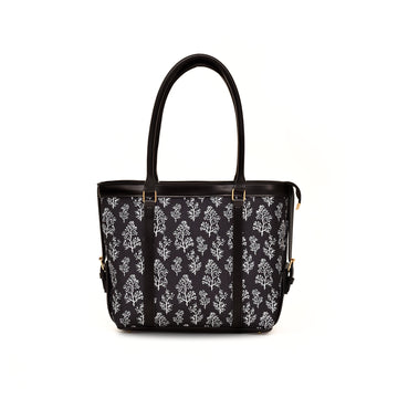 Canvas Bag - Black handbag with white floral pattern on a white background